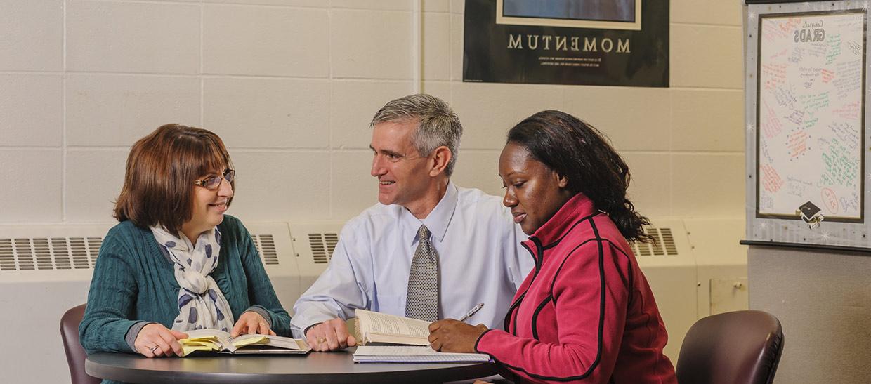 Students meeting with a counselor